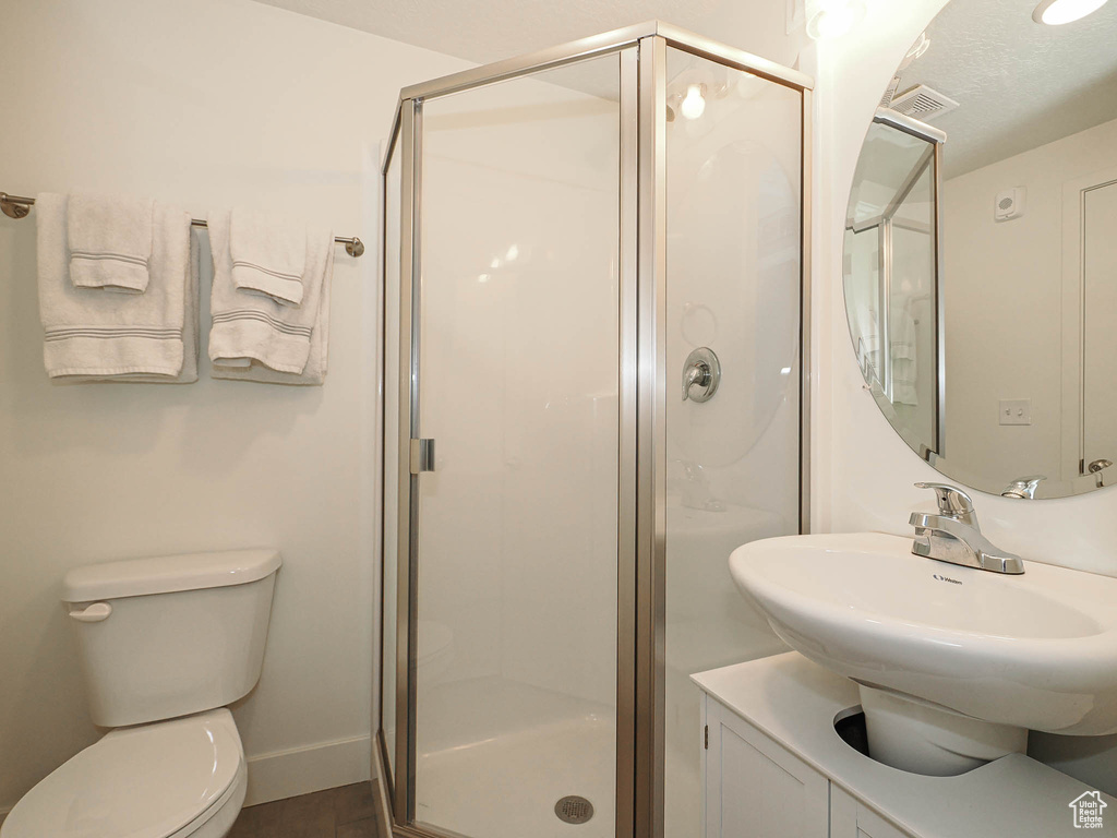 Full bathroom with a stall shower and vanity
