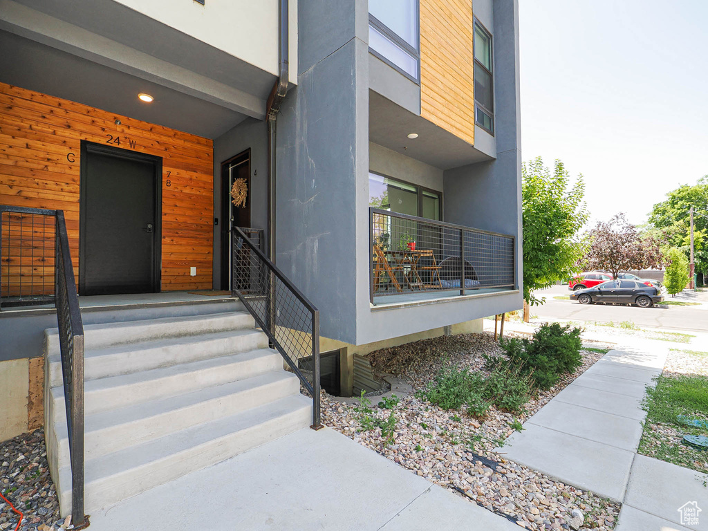 Entrance to property featuring stucco siding