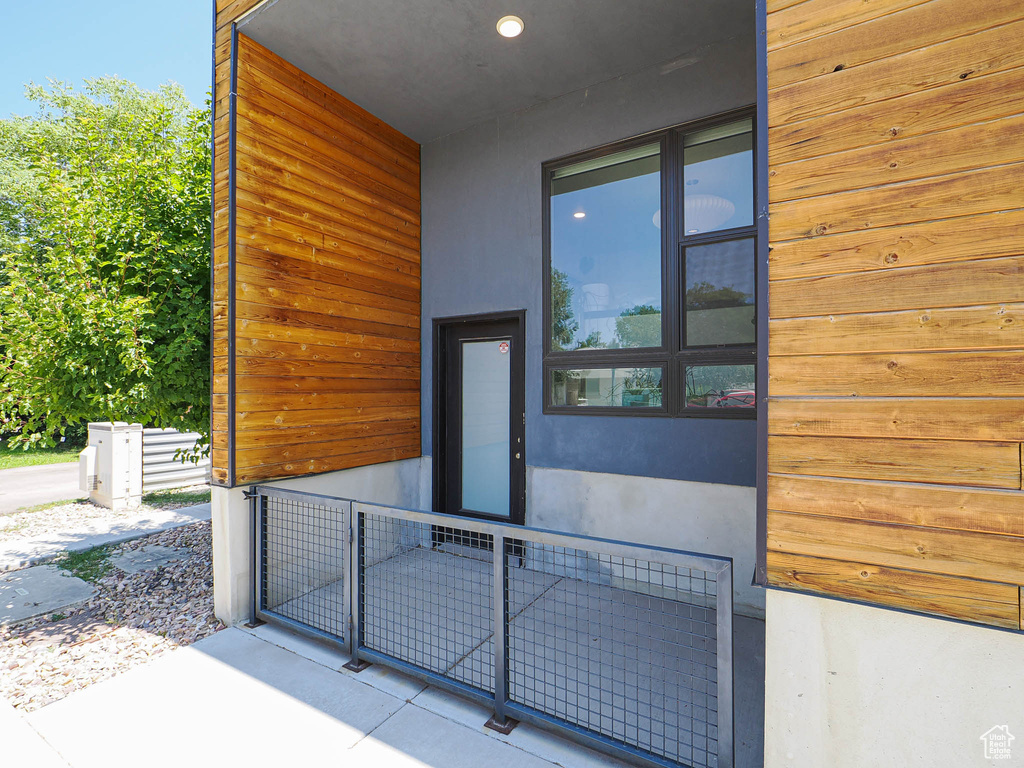View of exterior entry featuring stucco siding