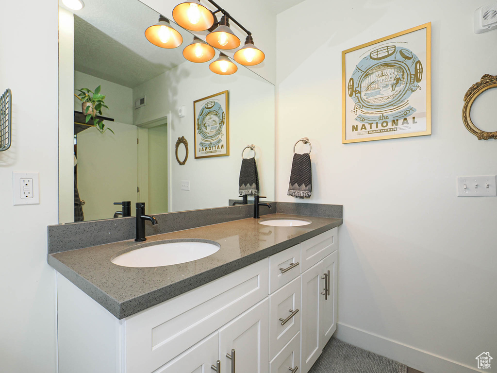 Bathroom featuring double vanity