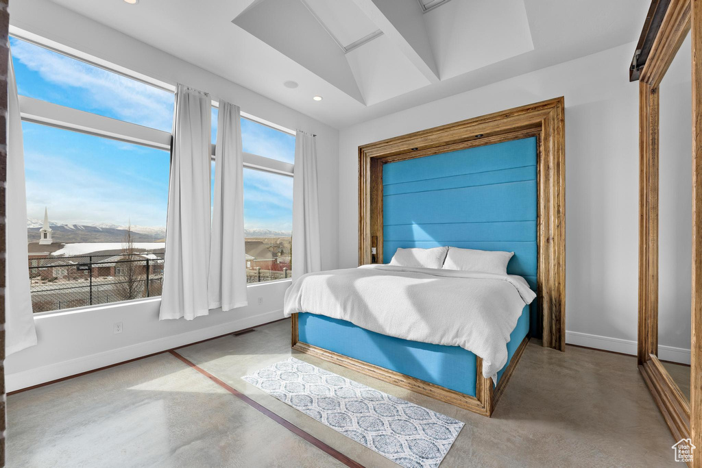 Bedroom featuring recessed lighting and concrete floors