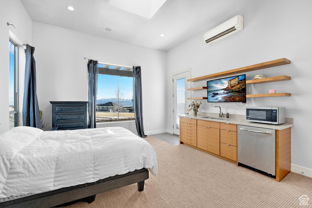 Bedroom with a wall mounted AC, a skylight, multiple windows, light carpet, and recessed lighting
