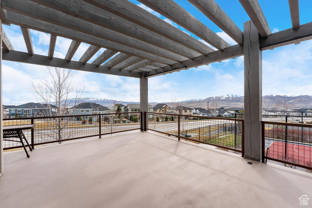 View of patio / terrace featuring a residential view, a pergola, and a mountain view