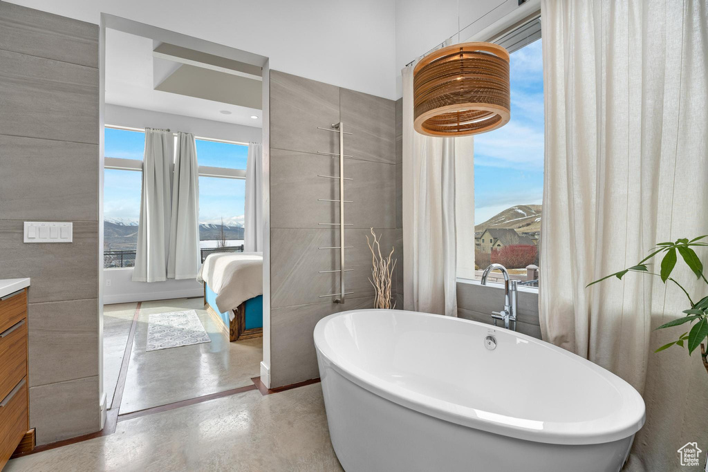 Bathroom featuring vanity and a freestanding tub