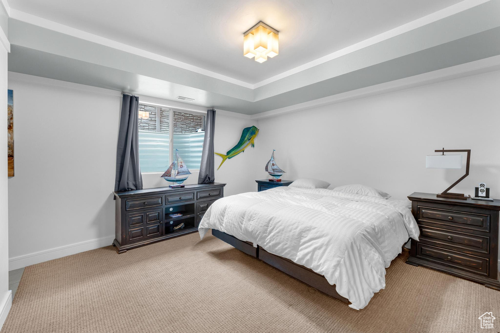 Carpeted bedroom featuring baseboards