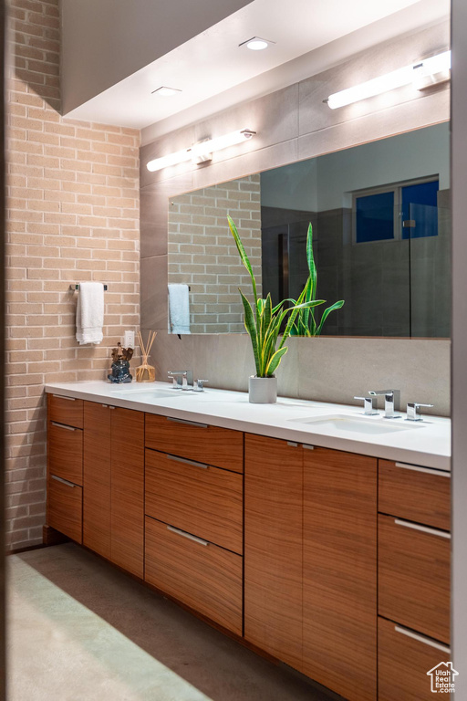 Bathroom featuring double vanity