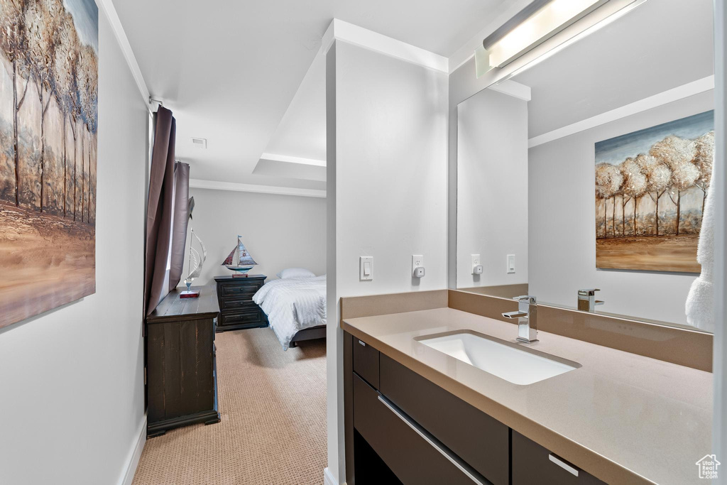 Ensuite bathroom featuring vanity