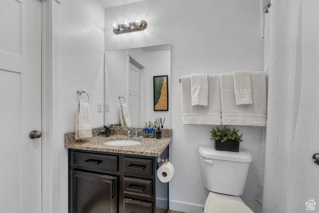 Bathroom with vanity and a shower with shower curtain
