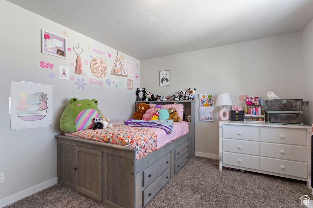 Carpeted bedroom with baseboards