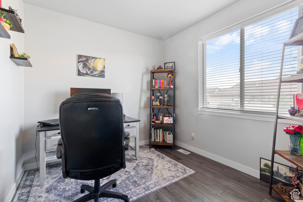 Office space featuring wood finished floors and baseboards