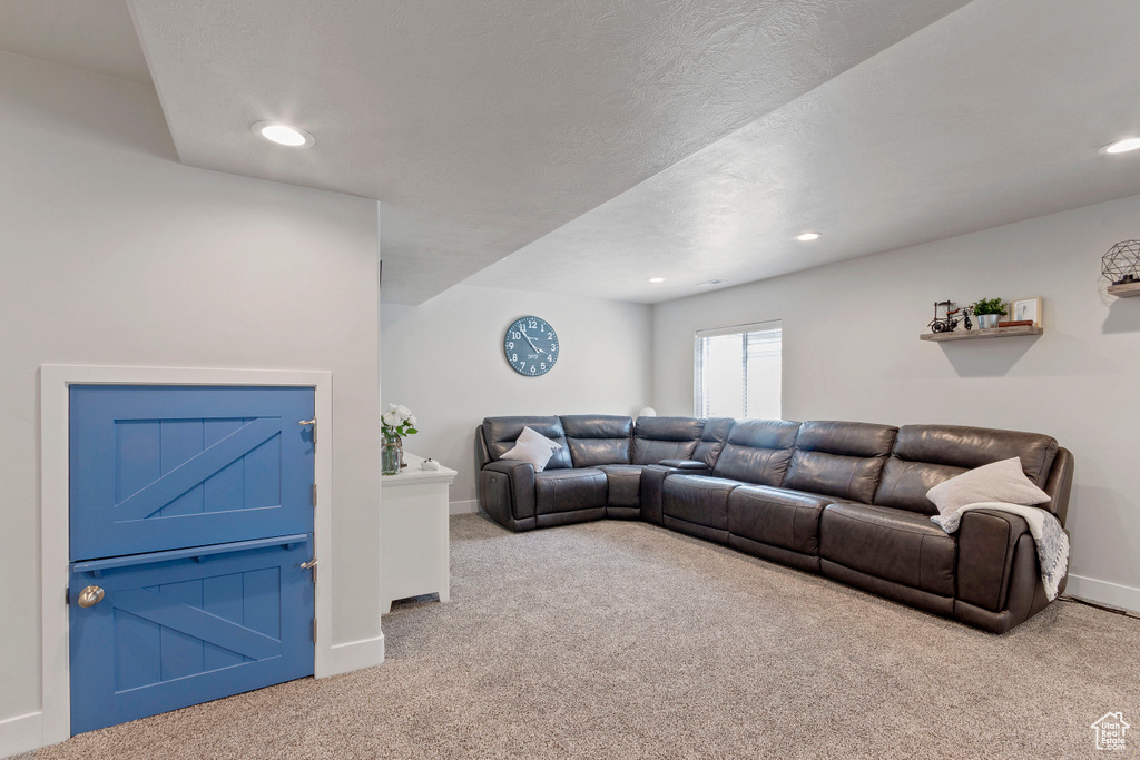 Living area with carpet and recessed lighting