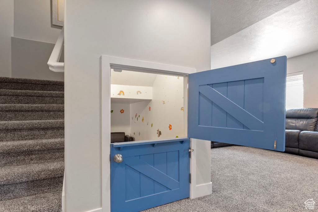 Stairway featuring carpet