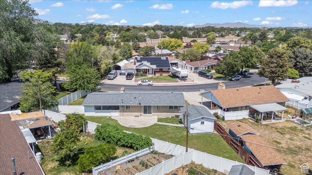 Aerial view of residential area featuring a mountain backdrop