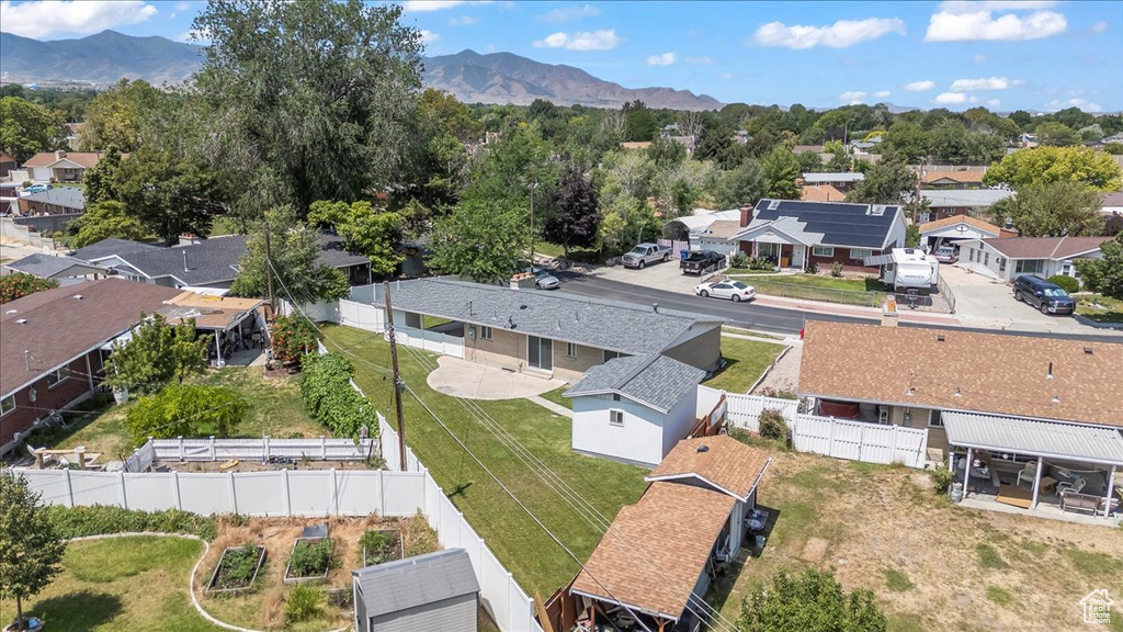 Aerial view of residential area featuring a mountain backdrop
