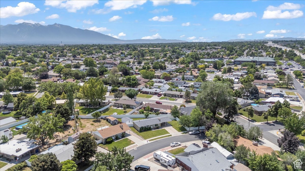 Aerial perspective of suburban area featuring a mountain backdrop
