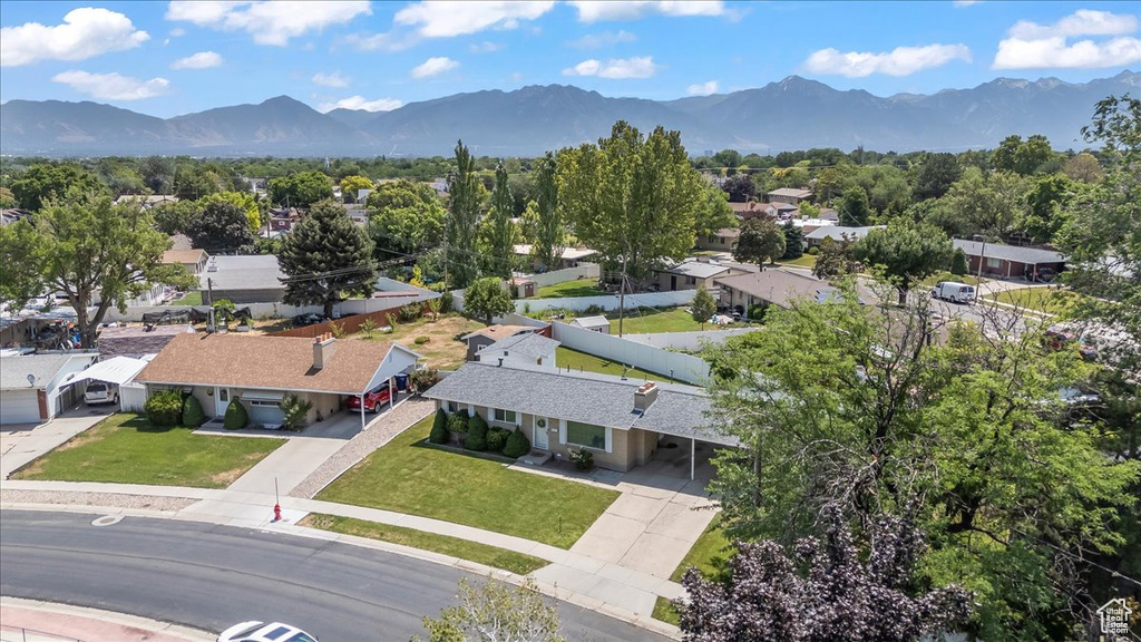 Aerial perspective of suburban area with a mountainous background