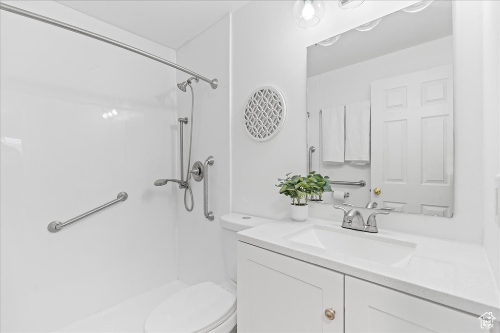 Full bathroom featuring a shower and vanity