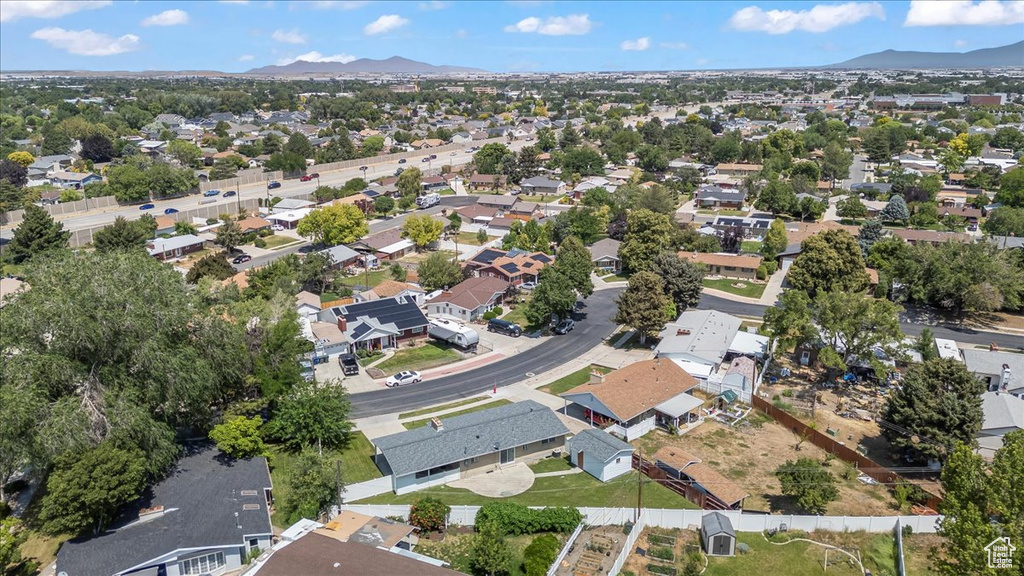 View of property location featuring a mountain backdrop and nearby suburban area