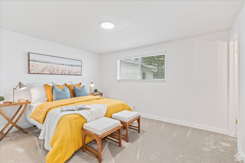 Carpeted bedroom with baseboards