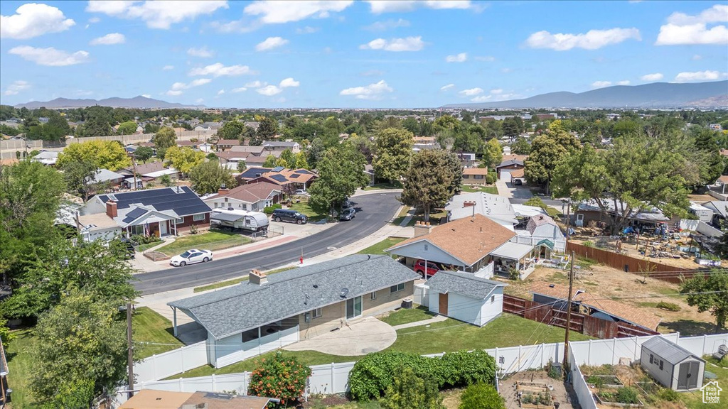 Aerial perspective of suburban area featuring a mountain backdrop