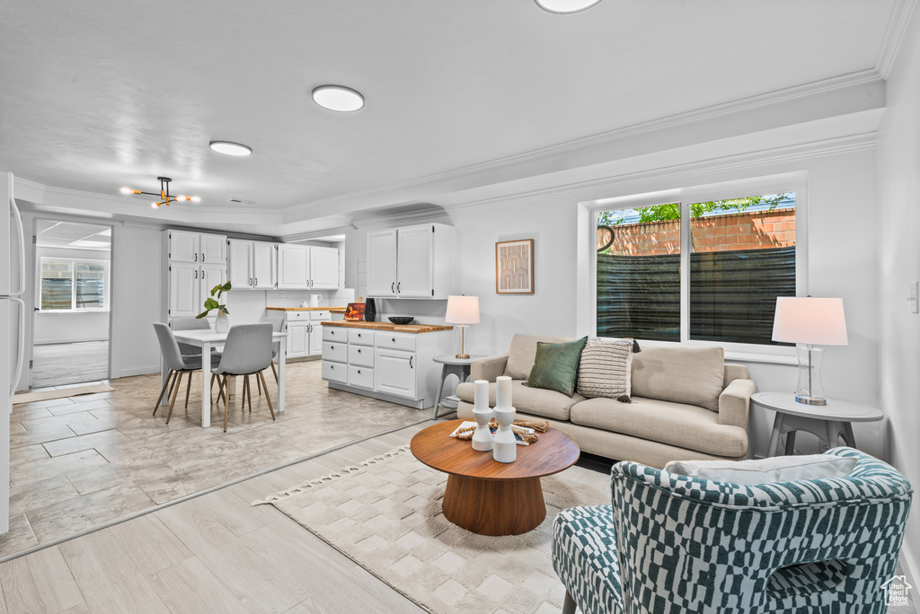Living area featuring crown molding