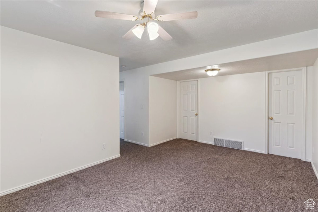 Unfurnished room with carpet floors and ceiling fan