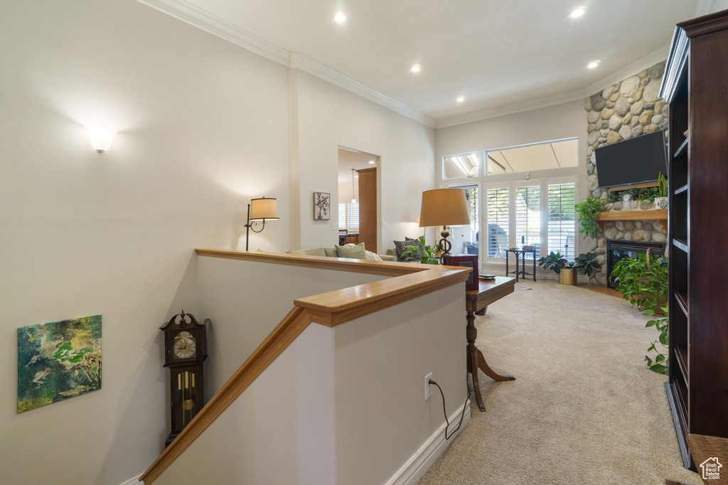 Hall with crown molding, light carpet, and recessed lighting