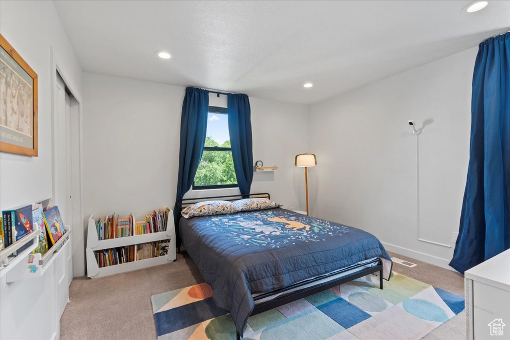 Carpeted bedroom featuring recessed lighting