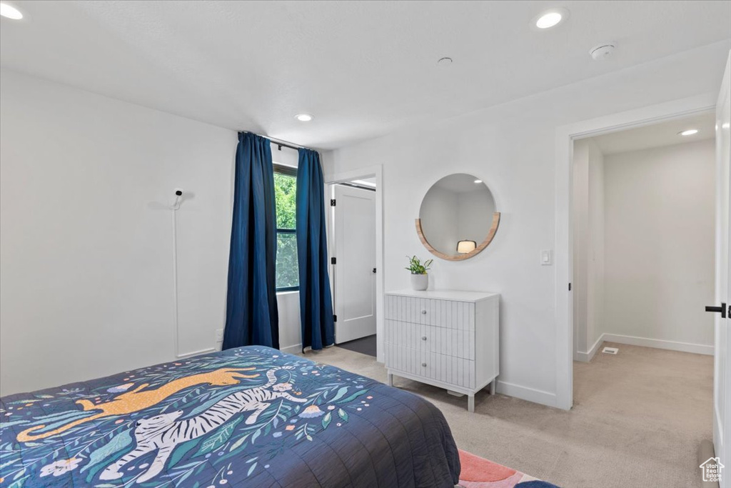 Bedroom featuring recessed lighting and light colored carpet