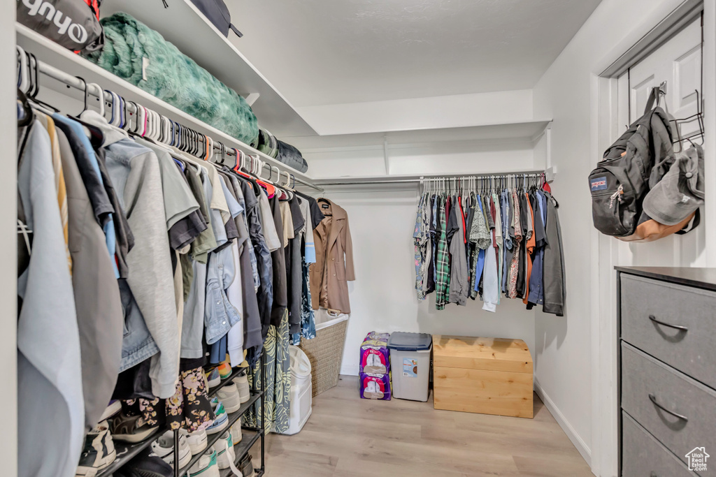 Spacious closet with wood finished floors