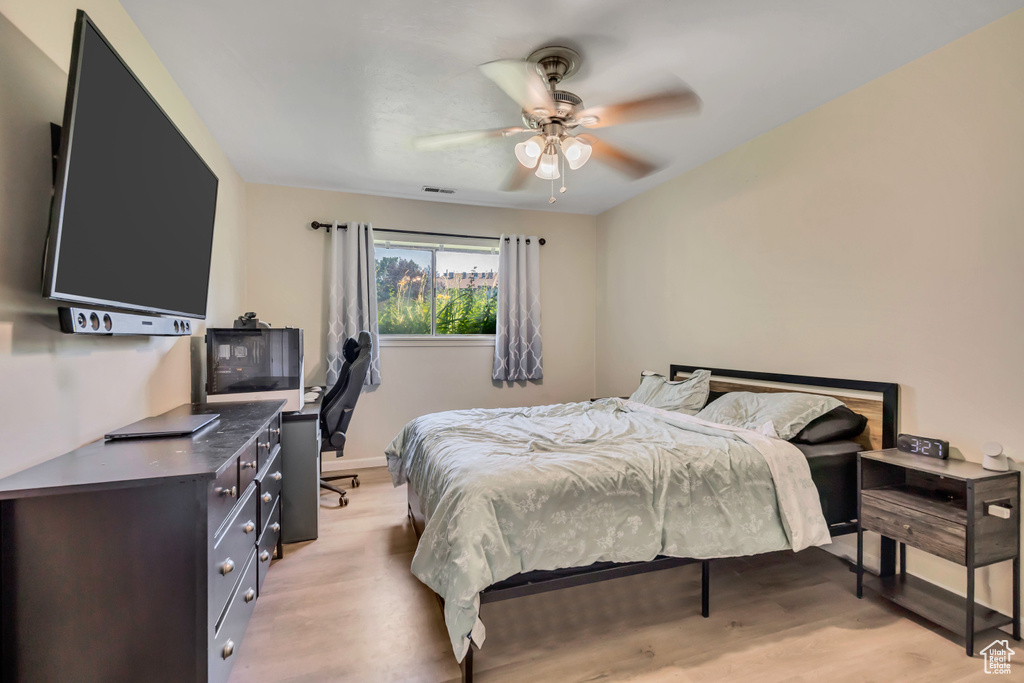 Bedroom featuring light wood finished floors and a ceiling fan
