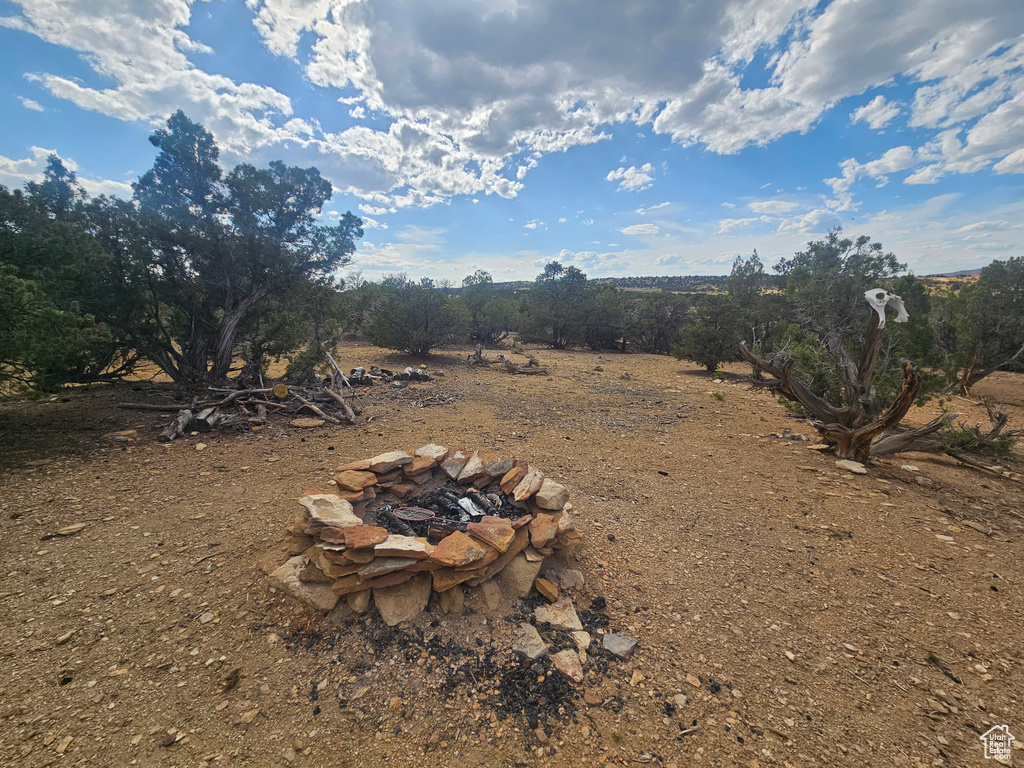 View of yard featuring an outdoor fire pit
