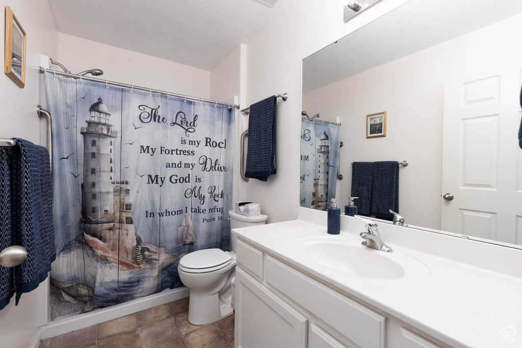 Full bathroom featuring vanity and curtained shower