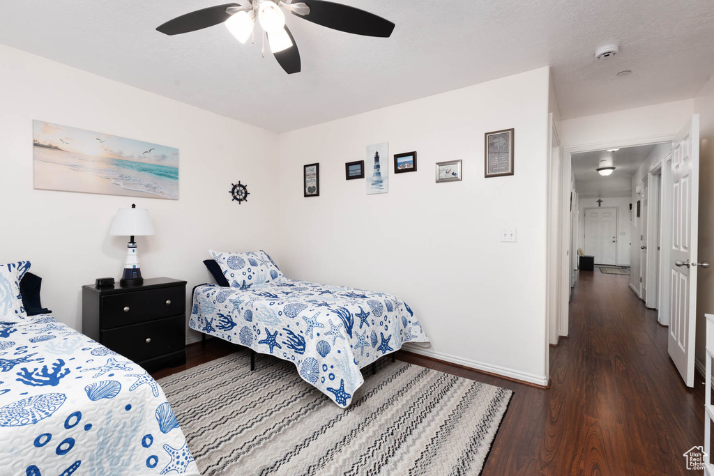 Bedroom featuring wood finished floors and ceiling fan