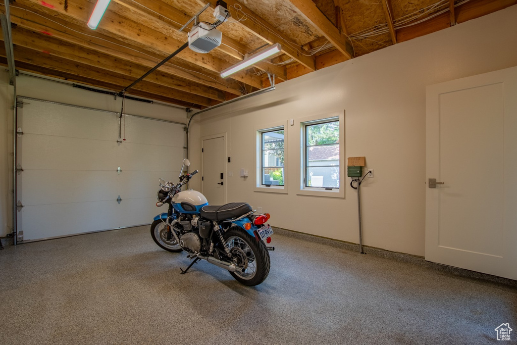 Garage featuring a garage door opener