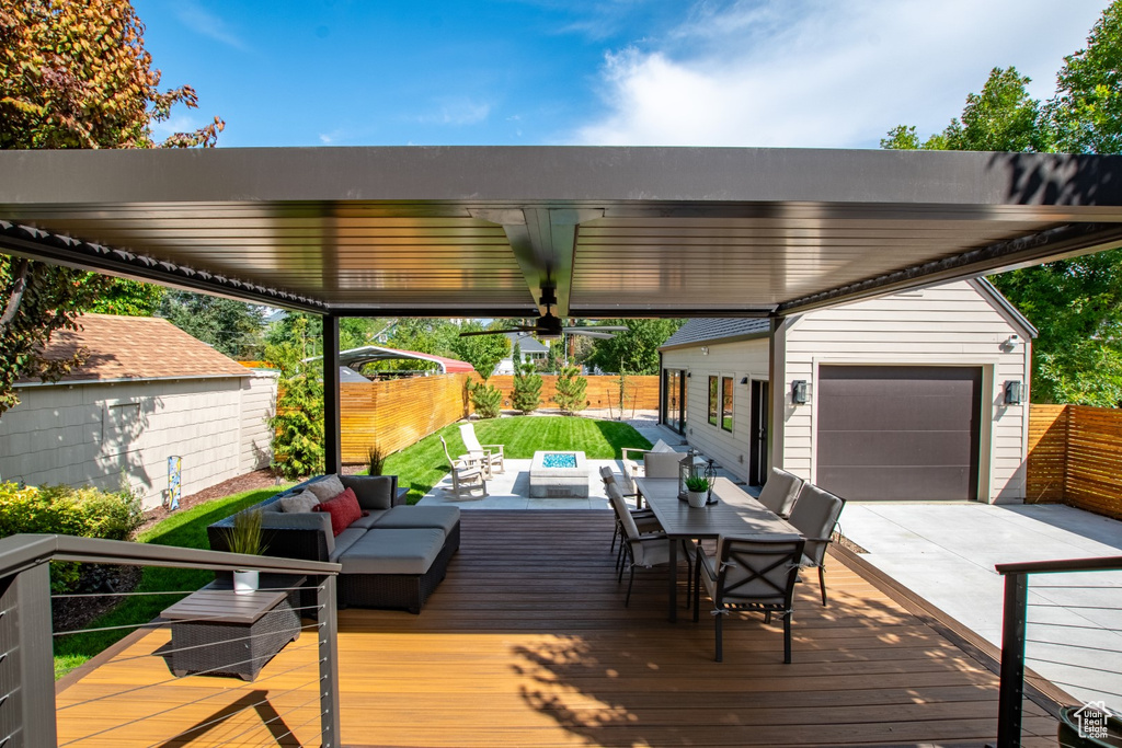 Wooden terrace featuring an outdoor hangout area and outdoor dining area