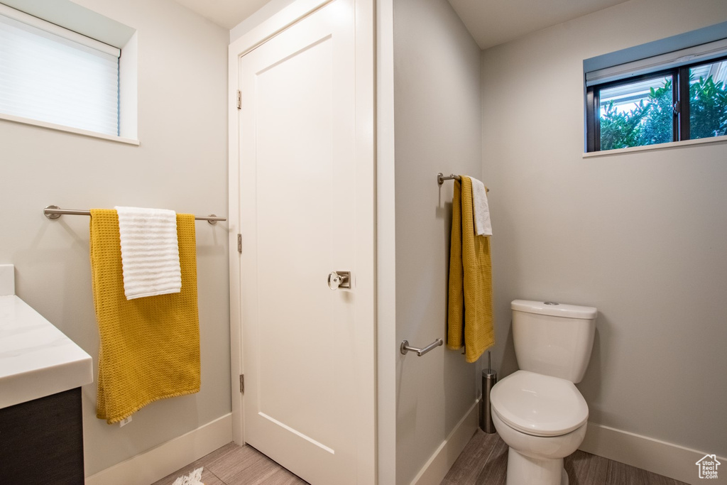 Bathroom featuring vanity and wood finished floors
