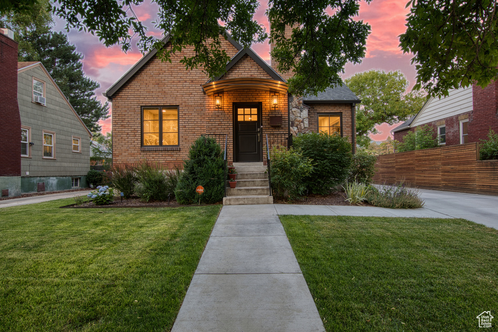 View of front of property featuring brick siding