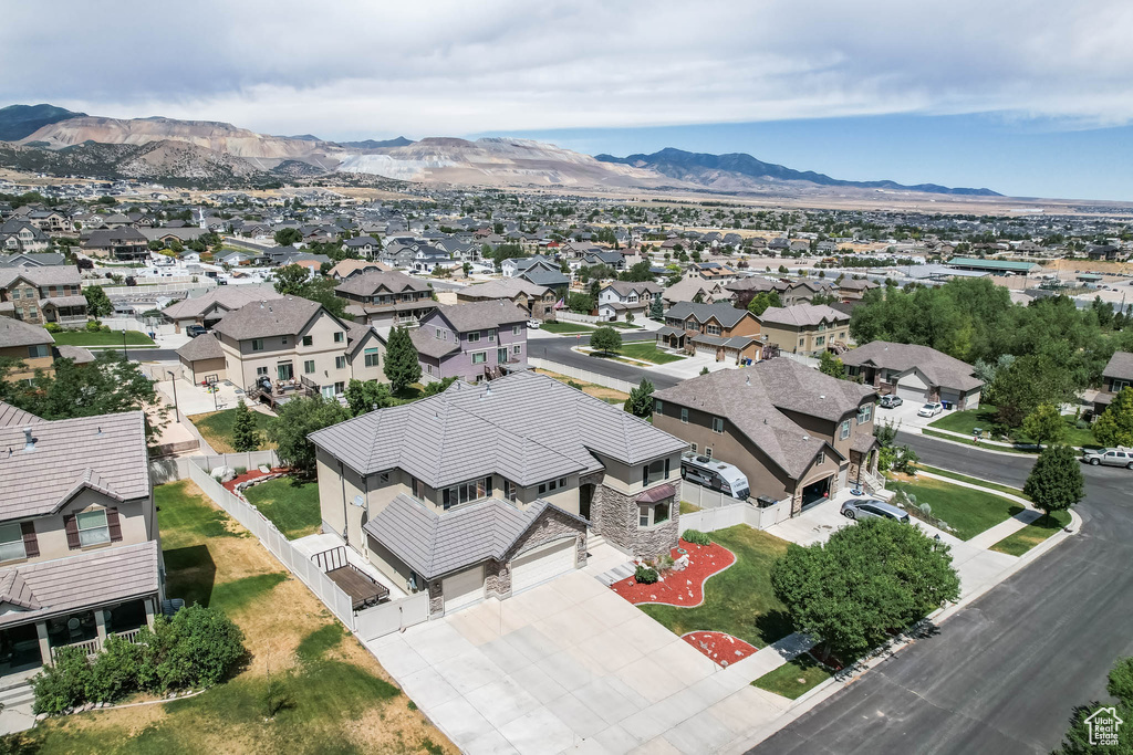 Aerial view of residential area with a mountainous background