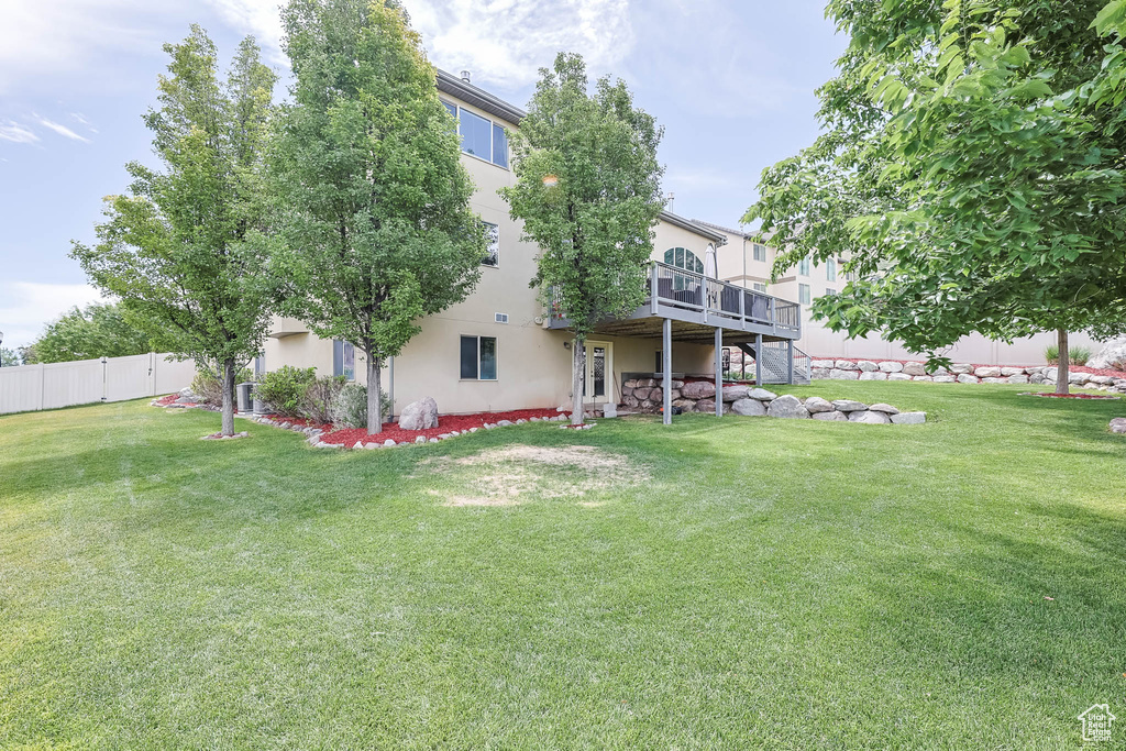 View of yard featuring a wooden deck