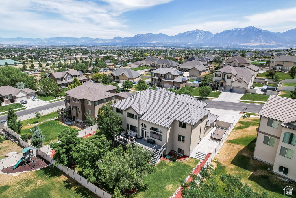 Aerial perspective of suburban area with a mountainous background