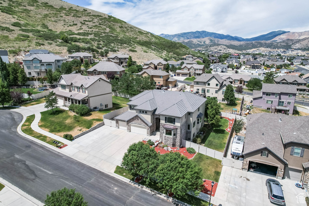 Aerial view of residential area featuring a mountain backdrop