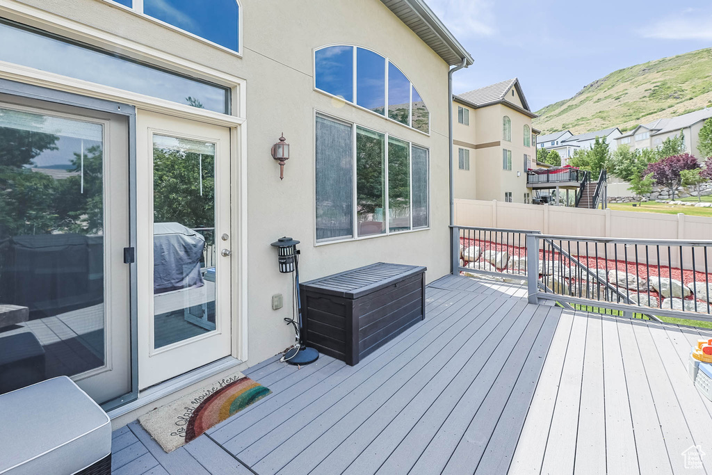 Wooden terrace featuring a mountain view