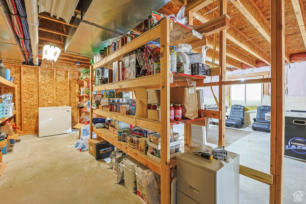 Below grade area with refrigerator