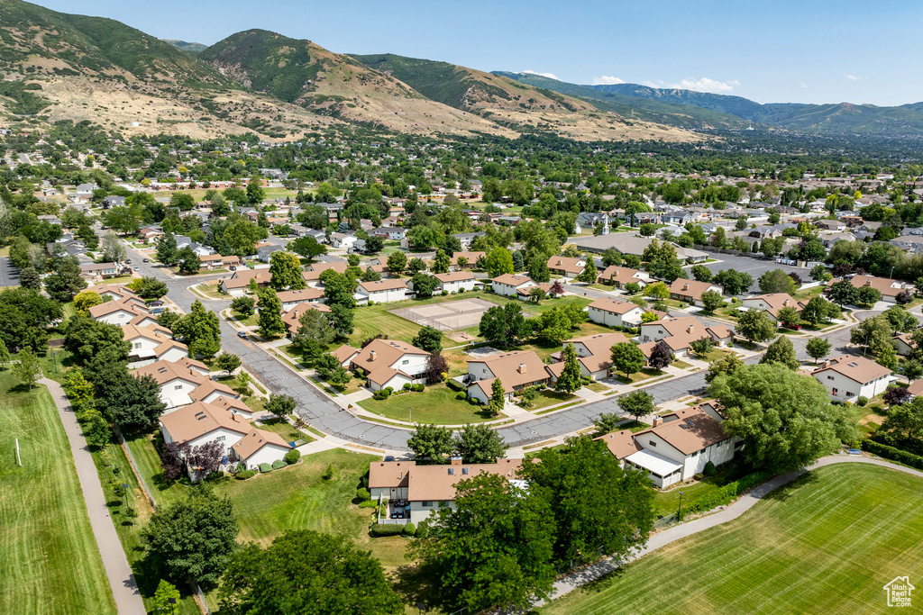 Aerial view of residential area with a mountainous background