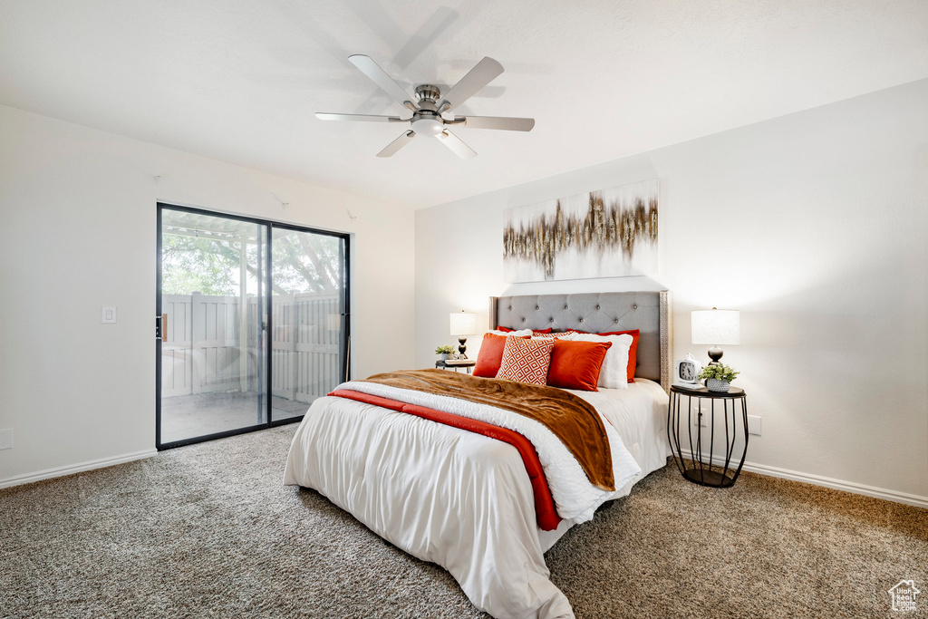 Bedroom featuring access to outside, carpet, and a ceiling fan