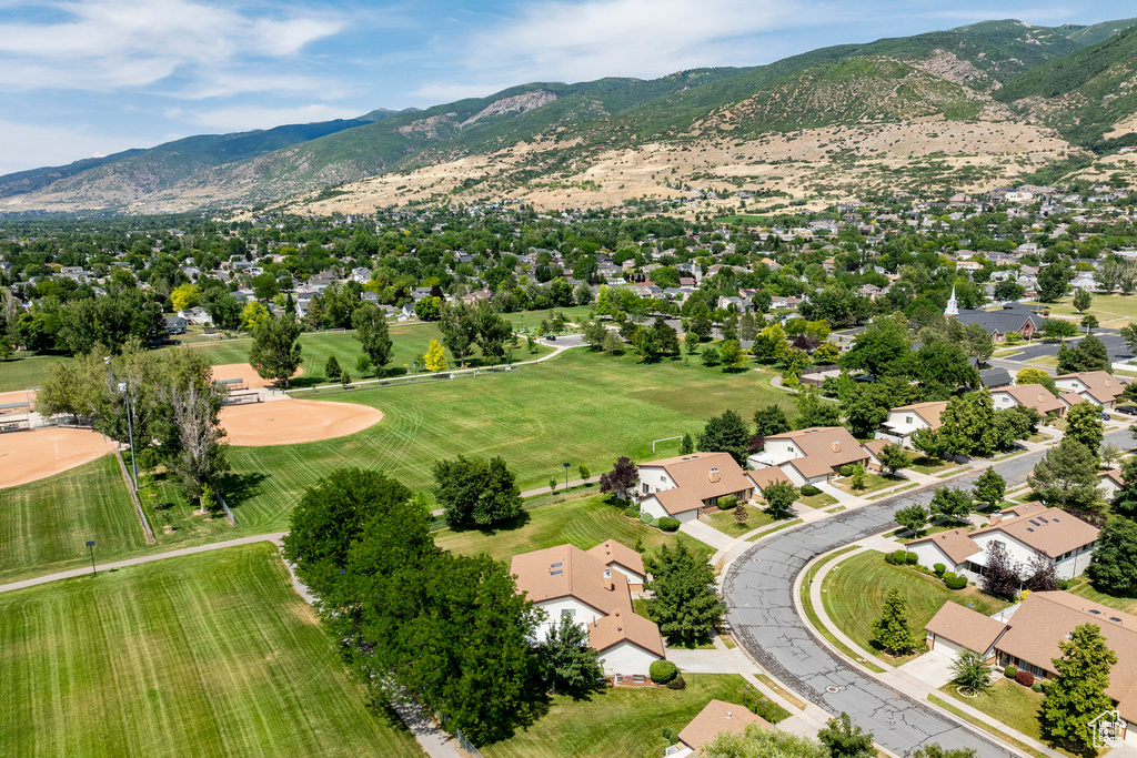 Aerial view of residential area featuring a mountain backdrop