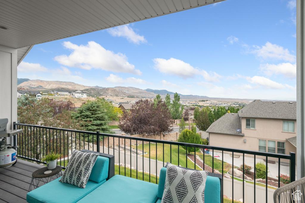 Balcony featuring a mountain view and a residential view
