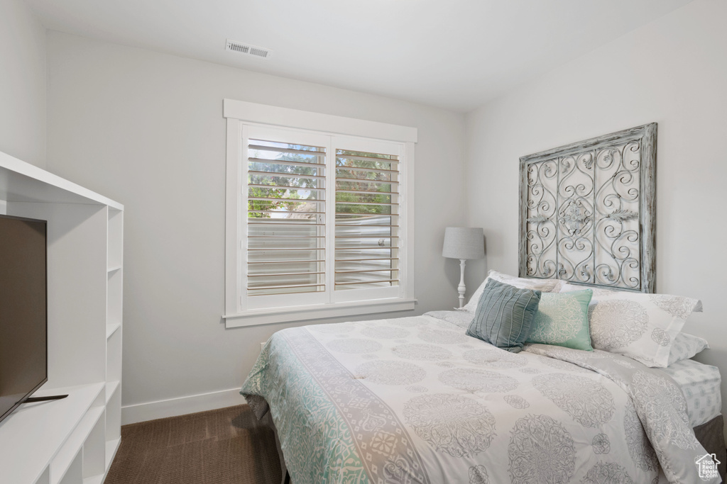 Bedroom with carpet and baseboards