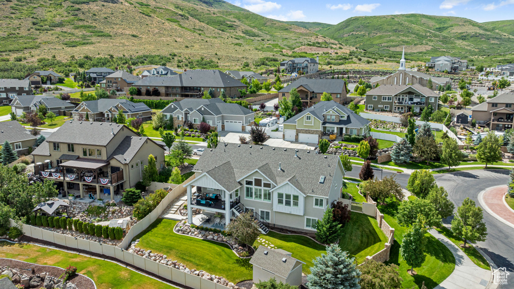 Aerial perspective of suburban area with a mountainous background